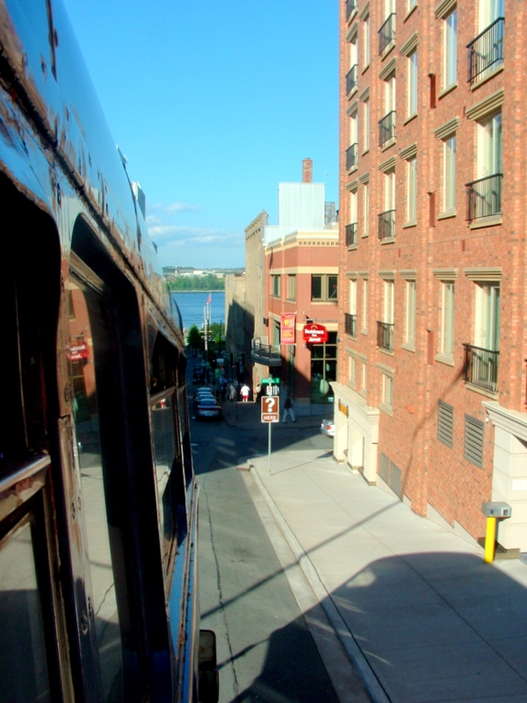 taken from a bus going downhill in Halifax. - water, streets, people, etc.