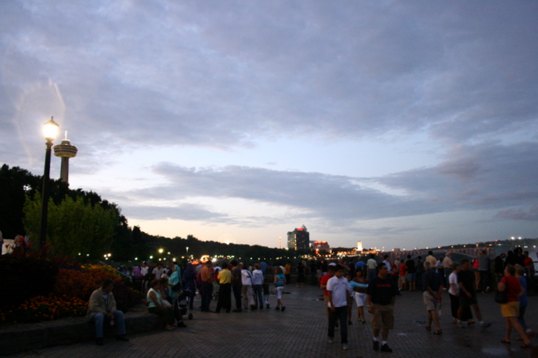 A crowd gathers to watch the sunset at Niagara Falls